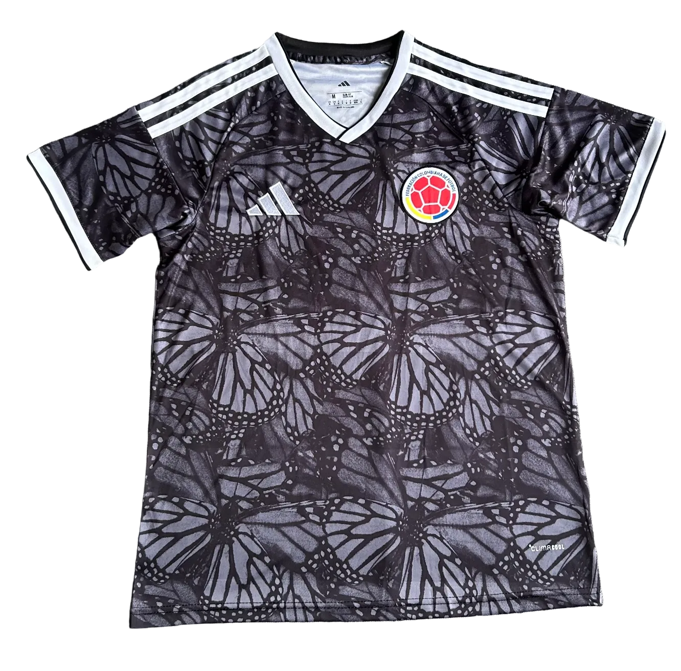 Camiseta negra mariposa de Colombia 2026